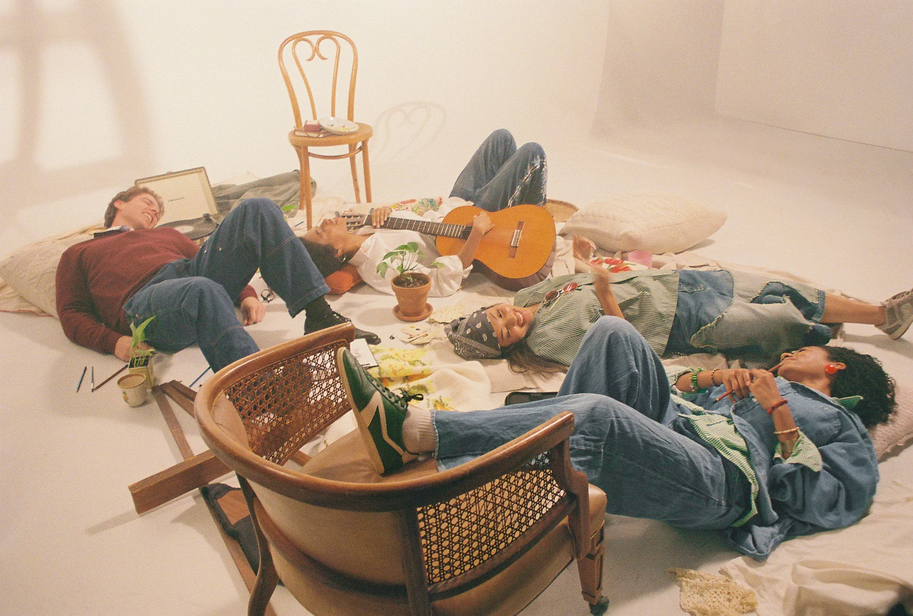 Friends relaxing together with a guitar.